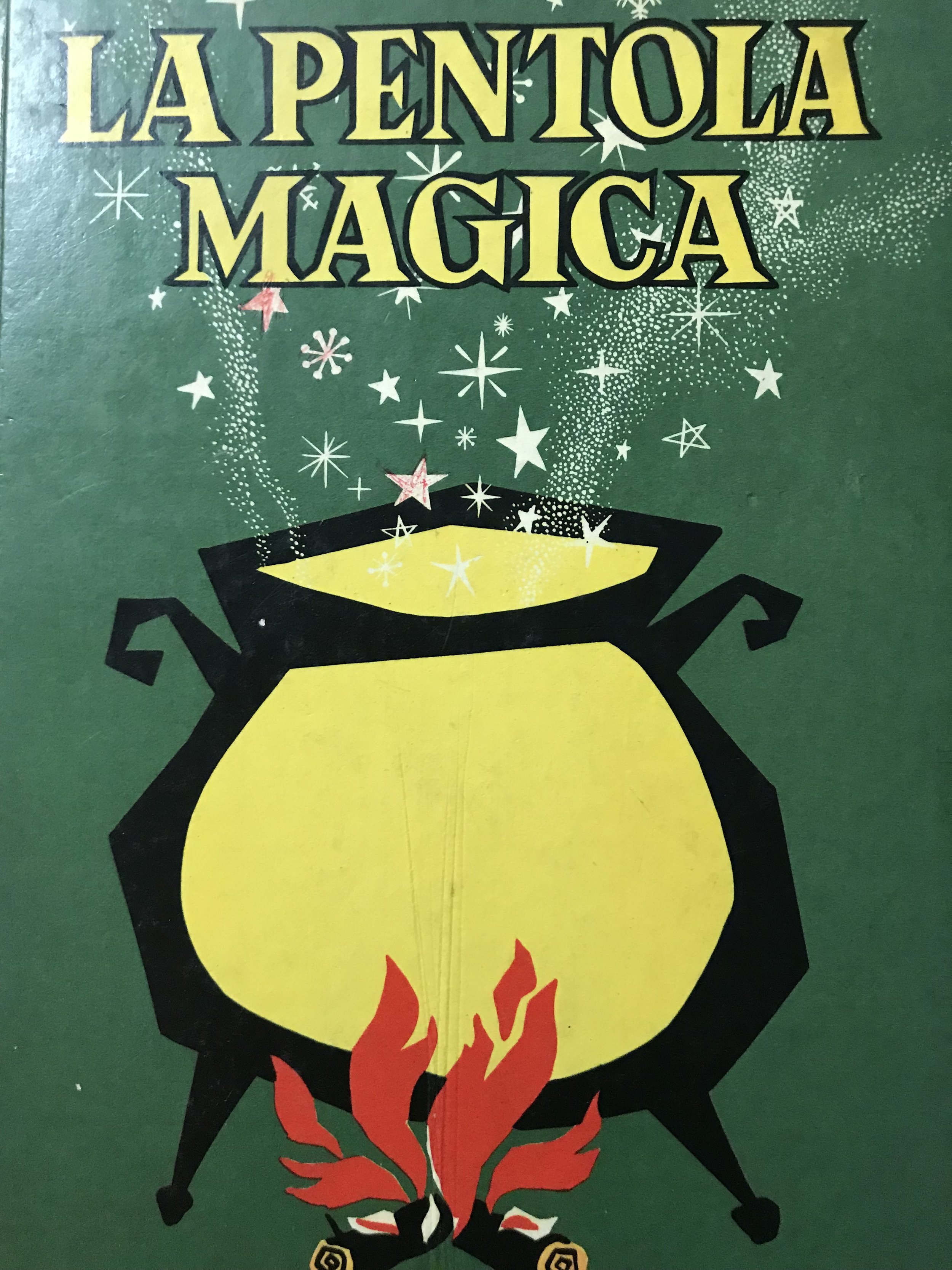 A poster with a cauldron over a fire and the words 'la pentola magica' above.